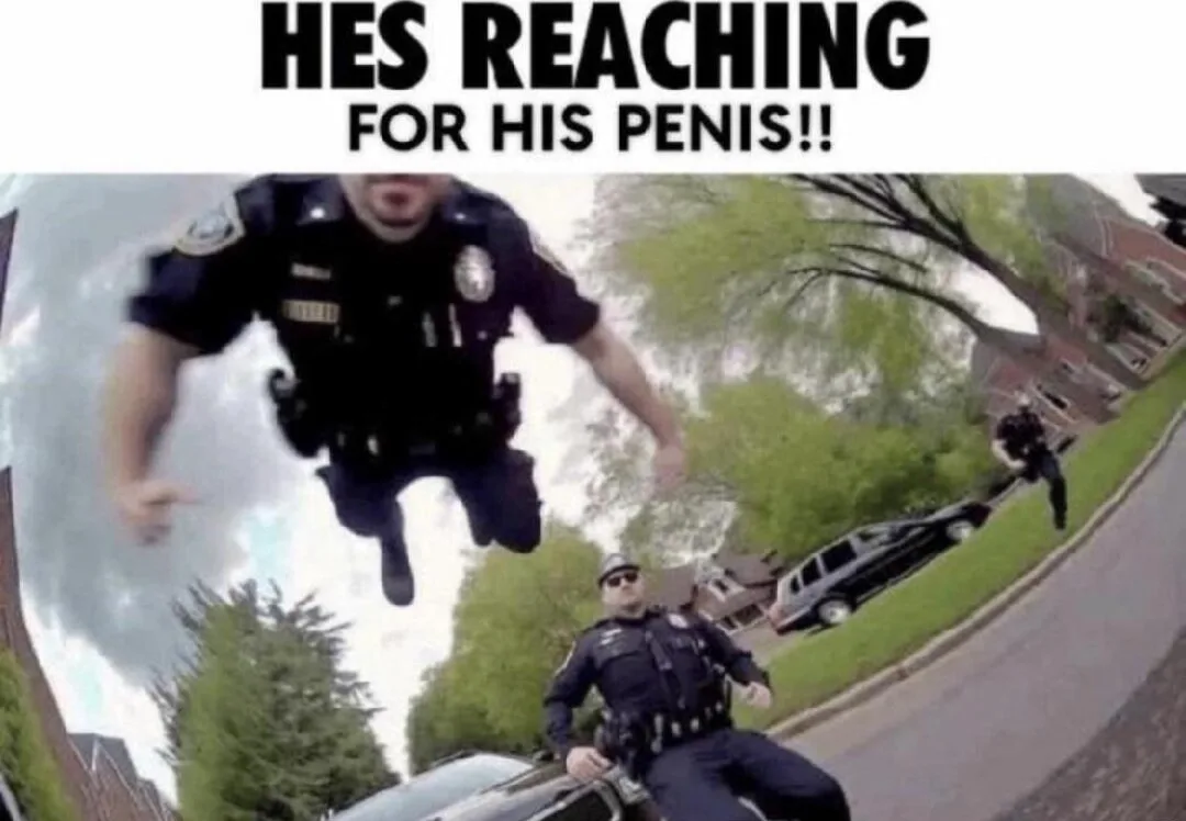 A fisheye lens photo shows a police officer in uniform seemingly floating or falling through the air with arms outstretched…