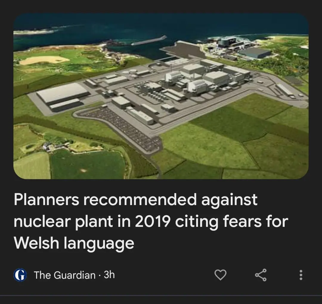 An aerial rendering of a large nuclear power plant complex situated on a coastal peninsula surrounded by green fields…