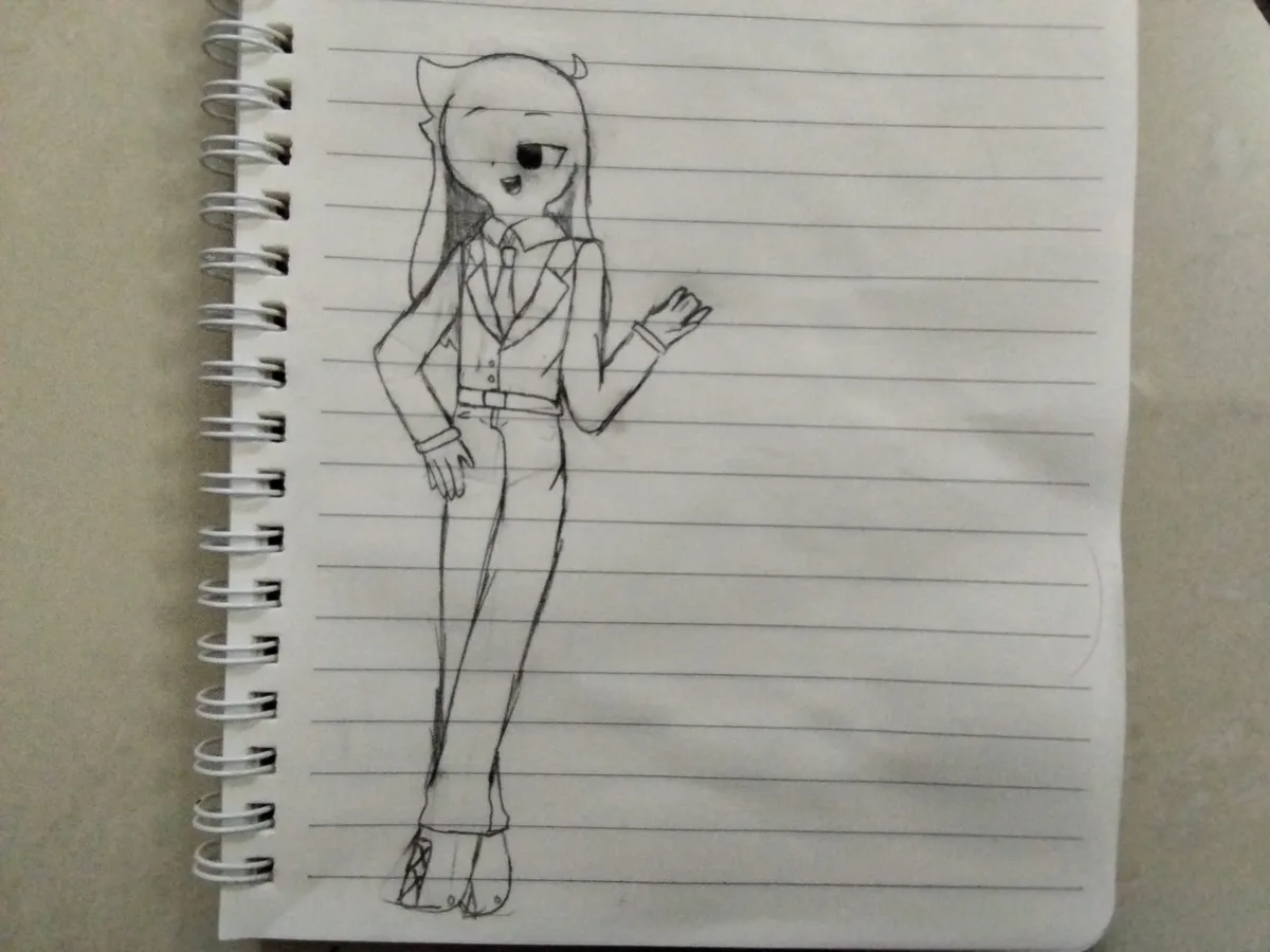 A hand-drawn pencil sketch on lined notebook paper shows an anime-style character with cat ears and a small horn, wearing a…