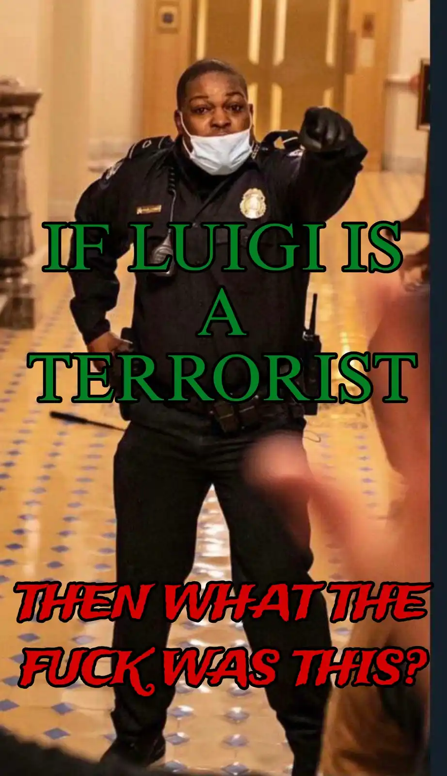 A police officer in uniform, wearing a face mask and pointing forward, stands in a hallway with tiled floors. Overlaid text…
