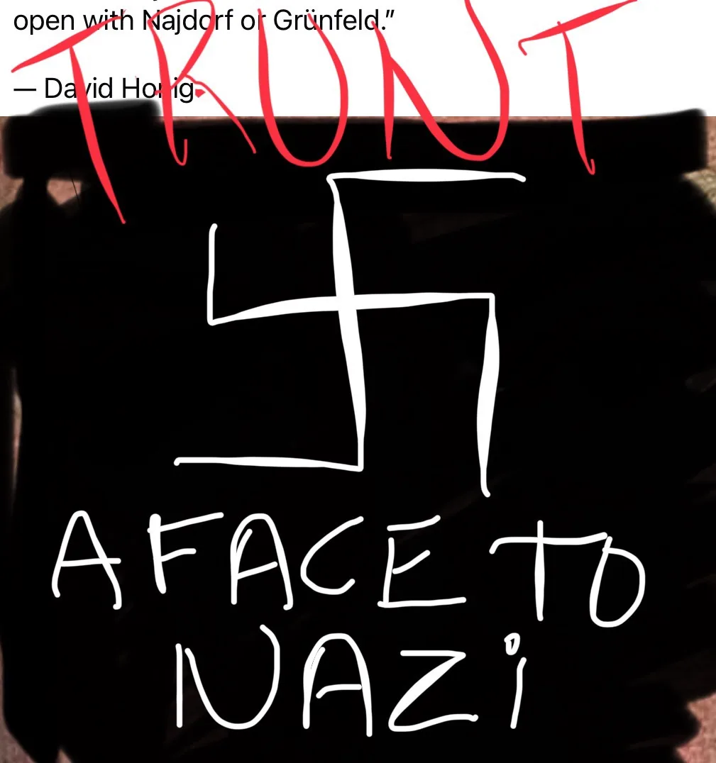The image displays a black background with a crudely drawn white swastika in the center. Above it, red handwritten text…