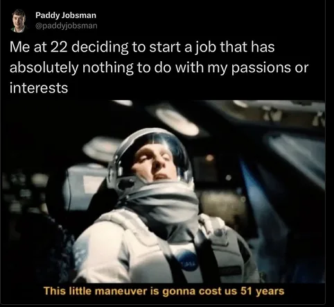 An astronaut in a NASA spacesuit sits in a spacecraft cockpit, looking upward with a resigned or overwhelmed expression. The…