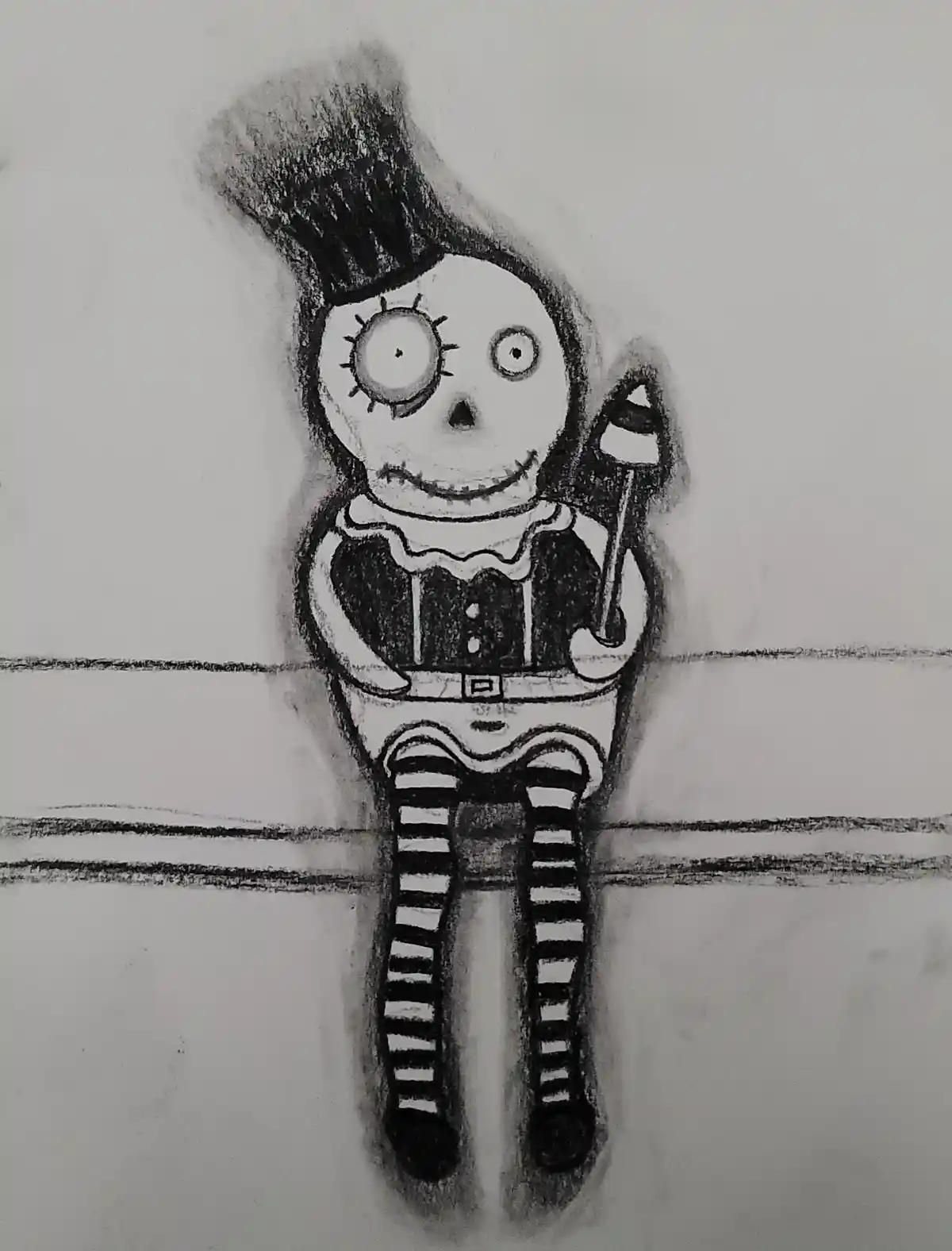 A black-and-white pencil drawing shows a stitched, skeletal clown with one large eye and one small eye, wearing a top hat, a…