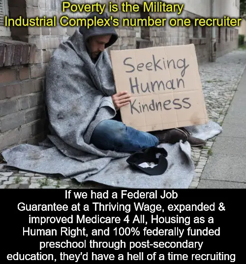 A person sitting on a sidewalk, wrapped in a blanket, holding a cardboard sign that reads 'Seeking Human Kindness'. Yellow…