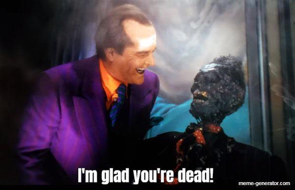 A man in a purple suit and orange shirt laughs maniacally while looking at a charred, burnt-out corpse in a suit. The text…