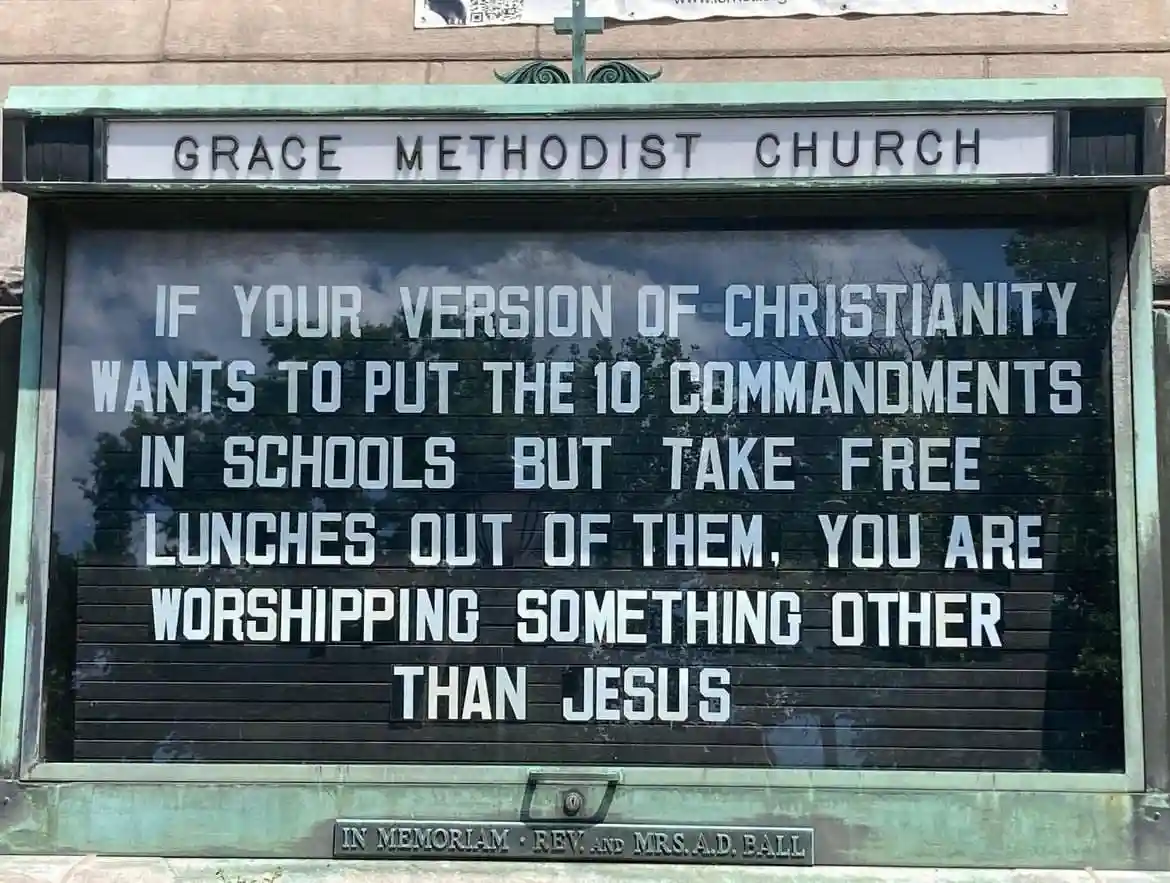 A photo of a church signboard for Grace Methodist Church displaying a message criticizing selective Christian values. The…