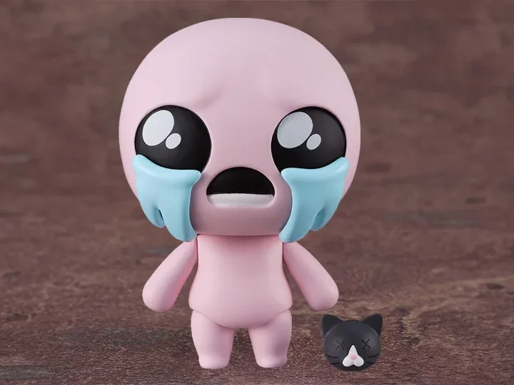 A pink, bald, chibi-style figurine with oversized black eyes and large blue tears streaming down its cheeks, standing on a…