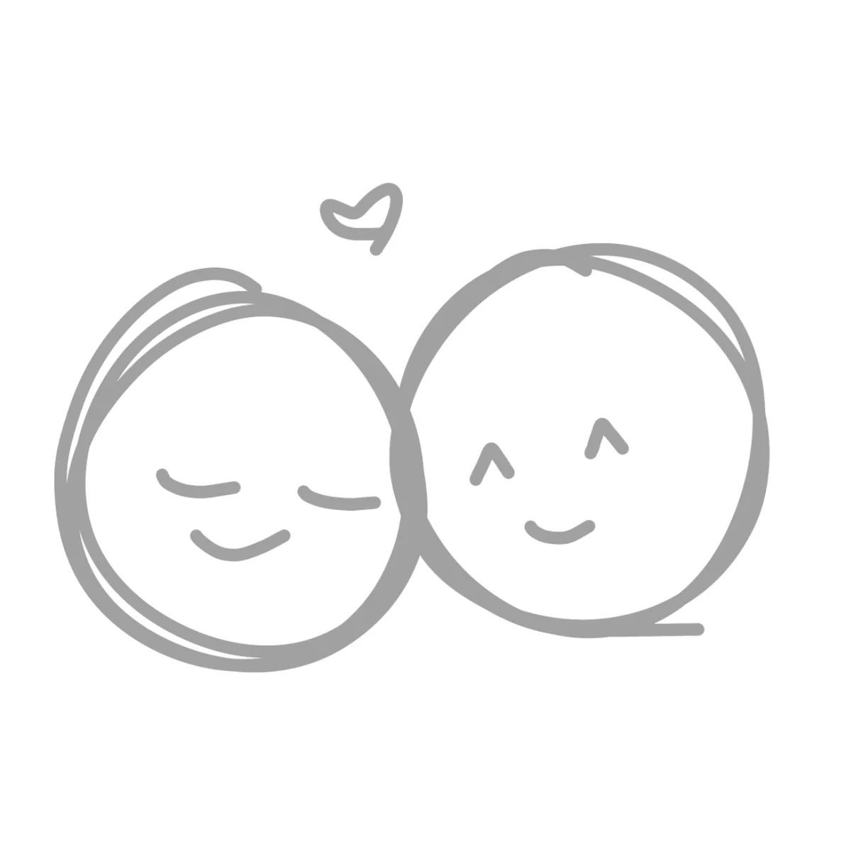 A simple gray line drawing shows two round, smiling cartoon faces touching each other, with a small heart above them…