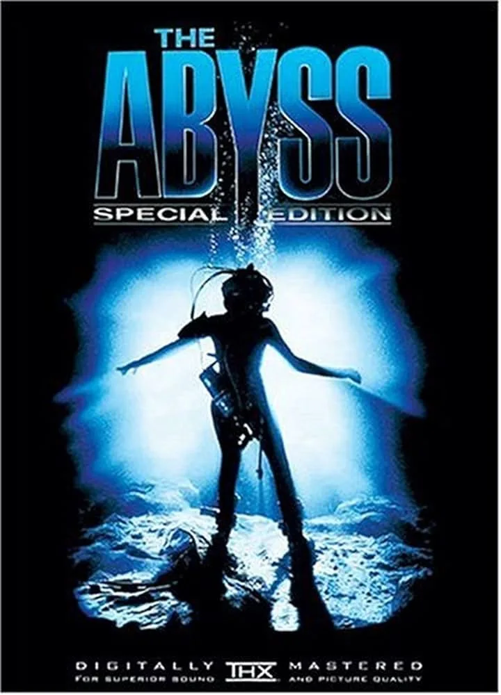 The image is a movie poster for 'The Abyss' special edition, featuring a silhouetted scuba diver standing on the ocean floor…