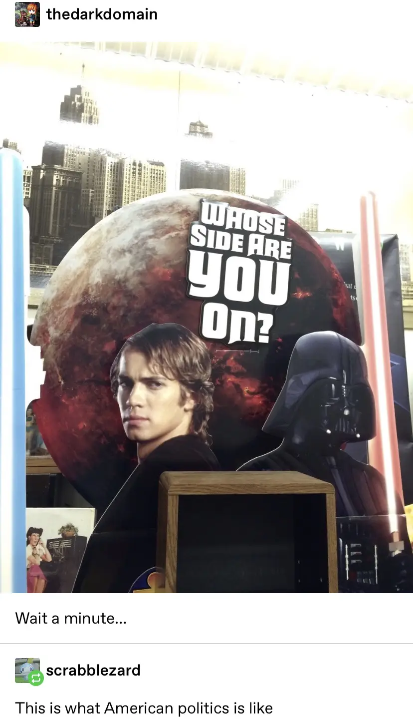 A photo of a Star Wars-themed 'Whose Side Are You On?' sign featuring Anakin Skywalker and Darth Vader, with a wooden box…
