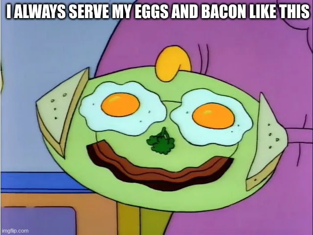A cartoon alien with a green face, two fried eggs for eyes, a strip of bacon for a mouth, and two slices of toast as ears…