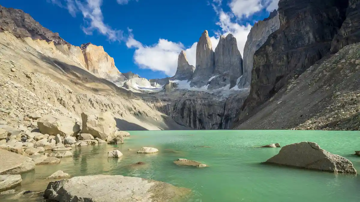 On a sunny summer day, the scenic reward for this 11-mile hike is a stunning vista. The cordillera's steeple-like towers…