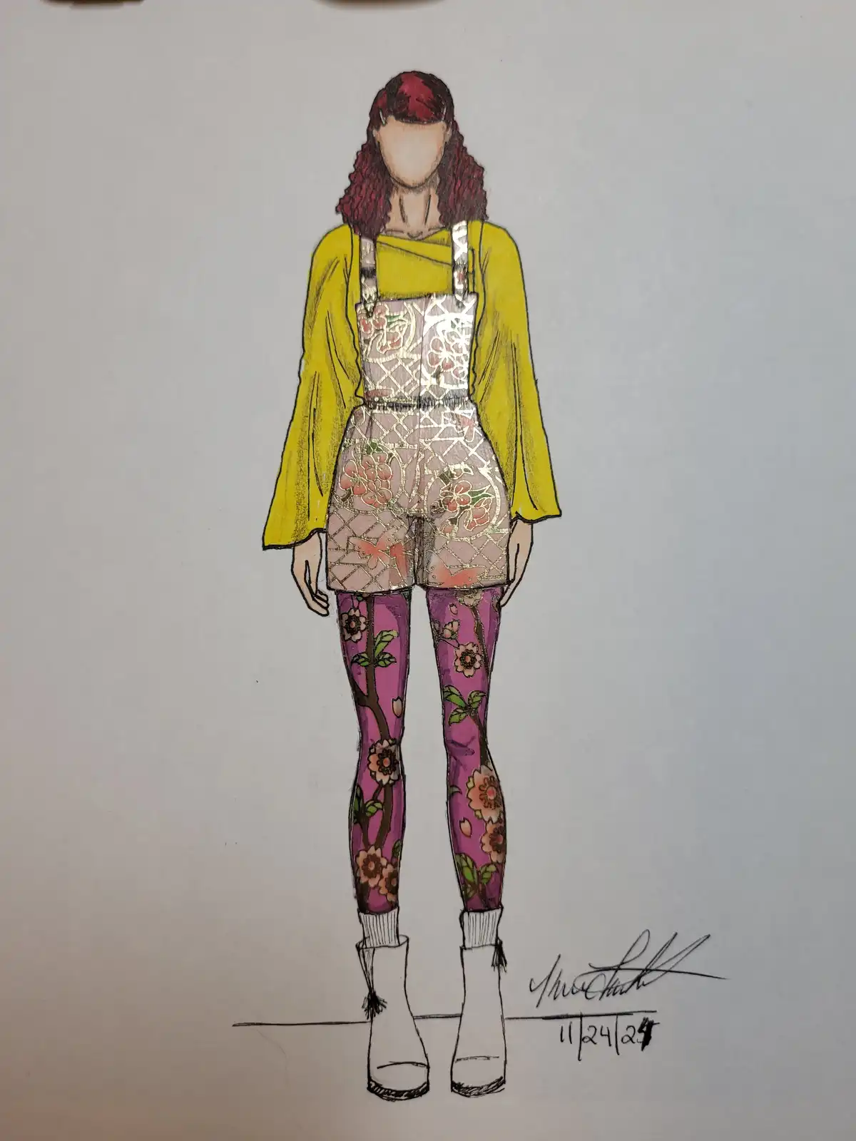 A fashion illustration of a person with red hair wearing a yellow top, patterned overalls, and floral leggings, standing on…