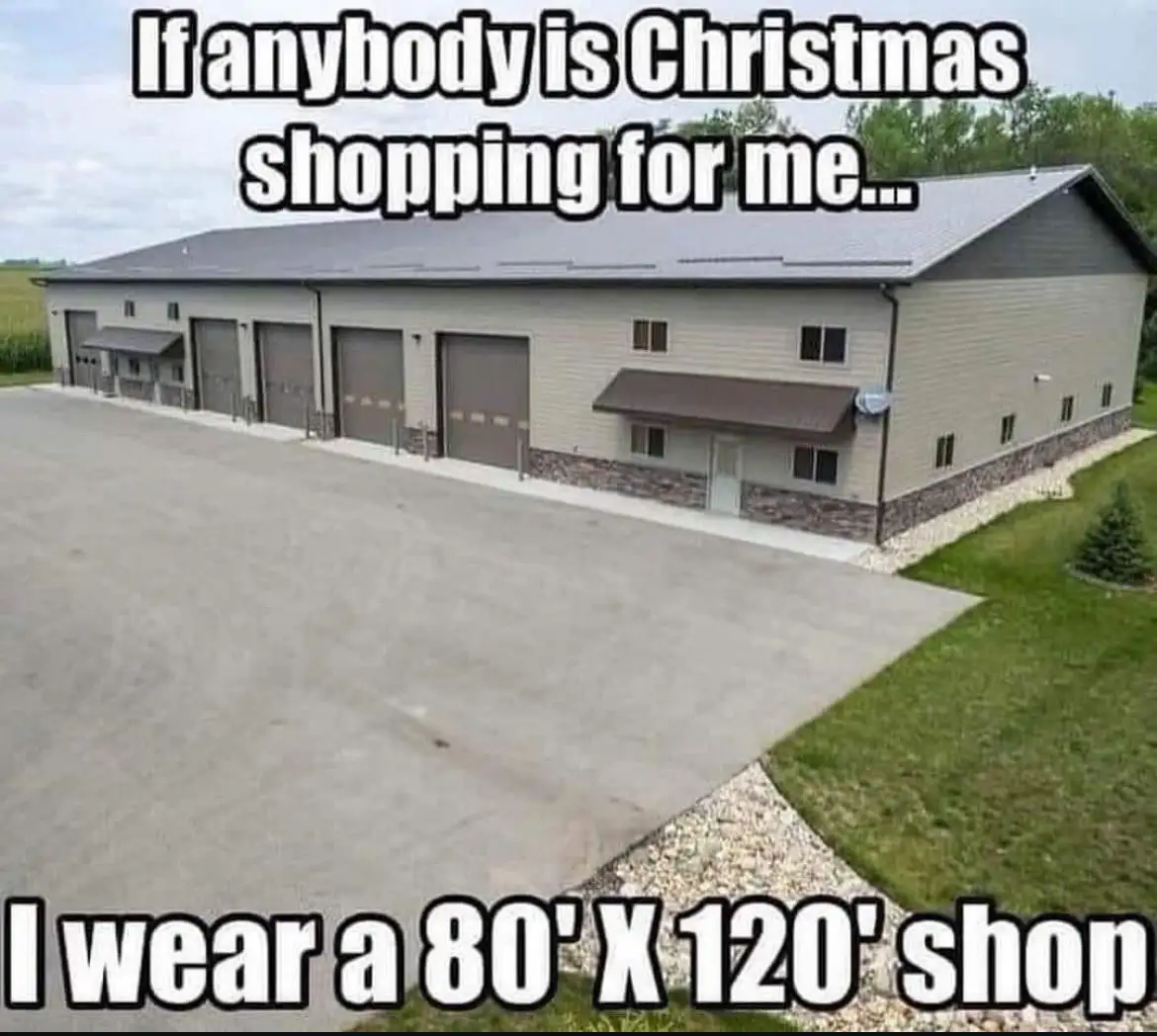 An aerial photo shows a large, beige commercial building with multiple garage doors and a paved parking lot. The text…
