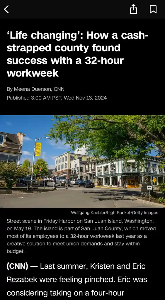 A screenshot of a CNN article about San Juan County implementing a 32-hour workweek. The image shows a sunny street scene in…