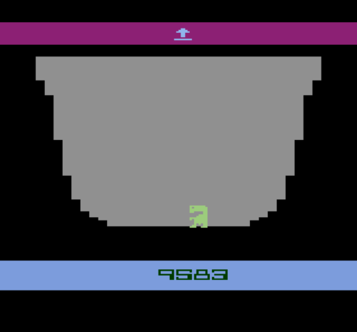 A pixelated green dinosaur stands at the bottom of a gray bowl-shaped arena, with a purple bar at the top containing a small…