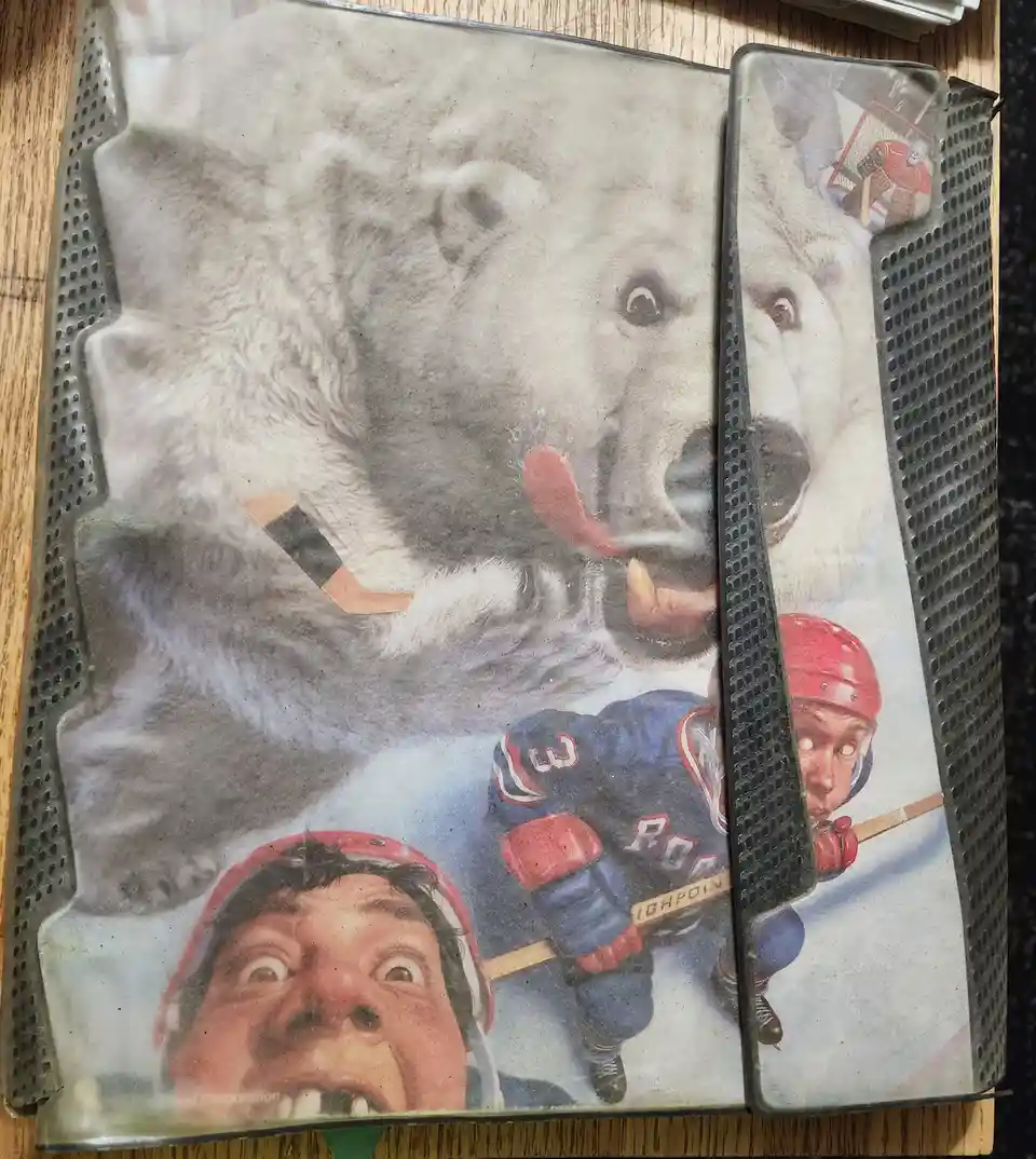 A split image shows a polar bear with a hockey stick in its mouth and a terrified hockey player below, with the text 'i'm…