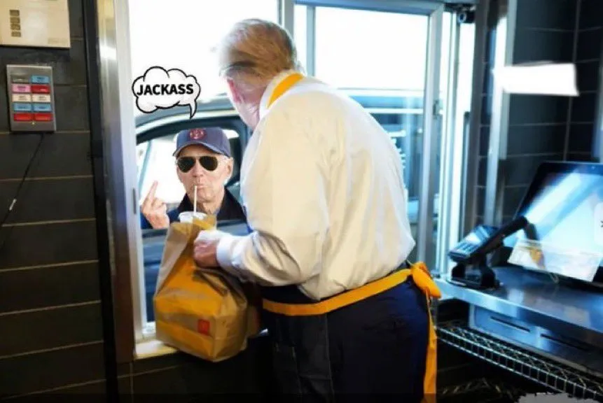 A man in a McDonald's uniform is handing a bag of food to a customer at a drive-thru window. The customer, wearing a cap and…