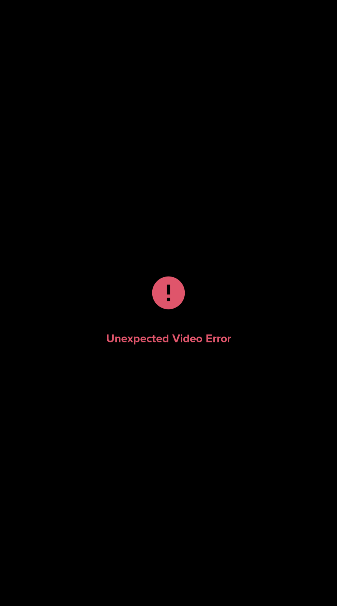 A black screen displays a red circle with a black exclamation mark inside, centered above the text 'Unexpected Video Error'…