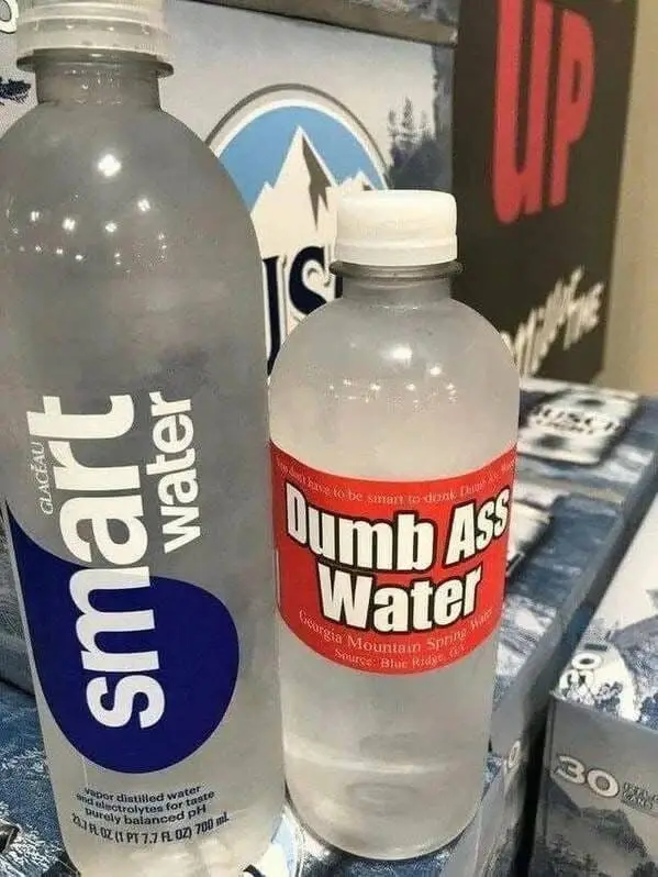 Two water bottles side by side: a branded 'smart water' bottle and a plain bottle with a red label that reads 'Dumb Ass…