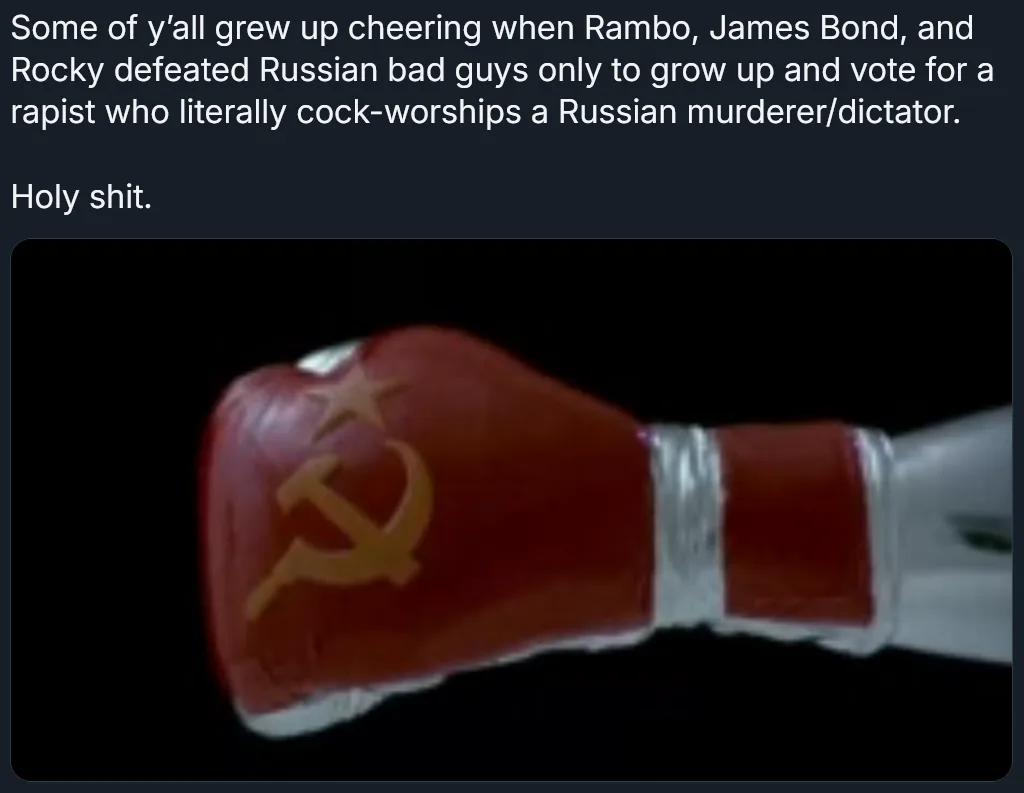 A close-up image of a red boxing glove with a gold hammer and sickle symbol, set against a black background. Overlaid white…