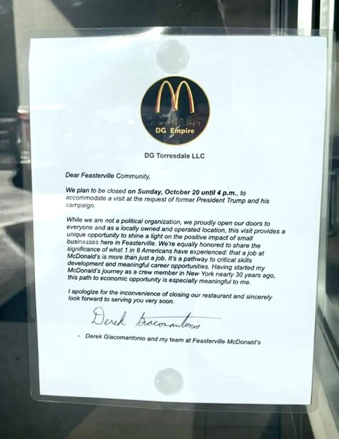 A printed letter from DG Torresdale LLC, a locally owned McDonald's in Feasterville, is taped to a glass door. The letter…