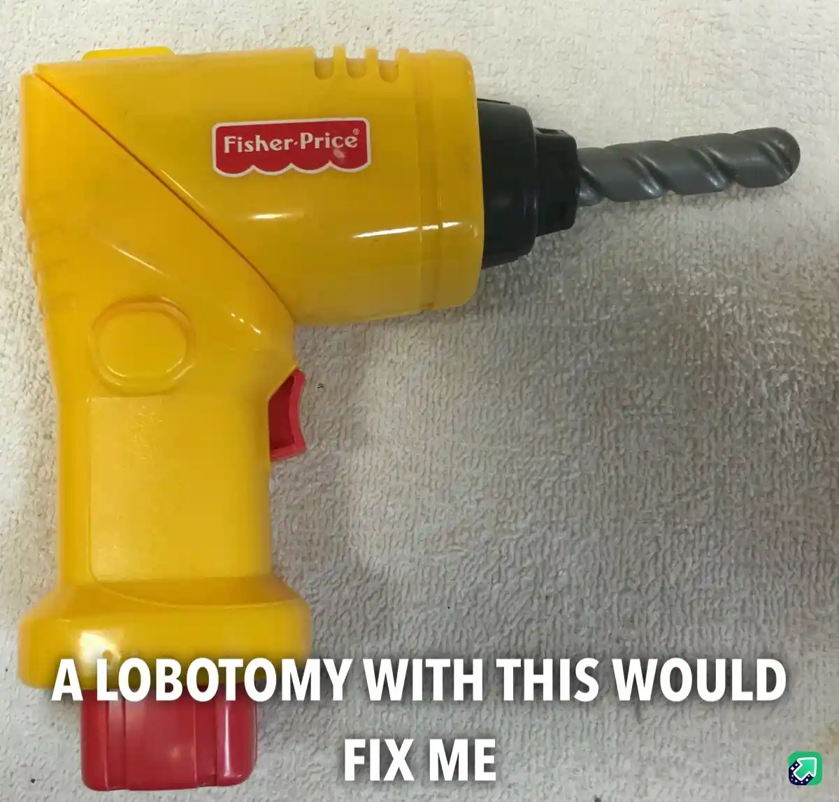 A yellow Fisher-Price toy power drill with a gray plastic drill bit rests on a textured white towel. The overlaid text reads…