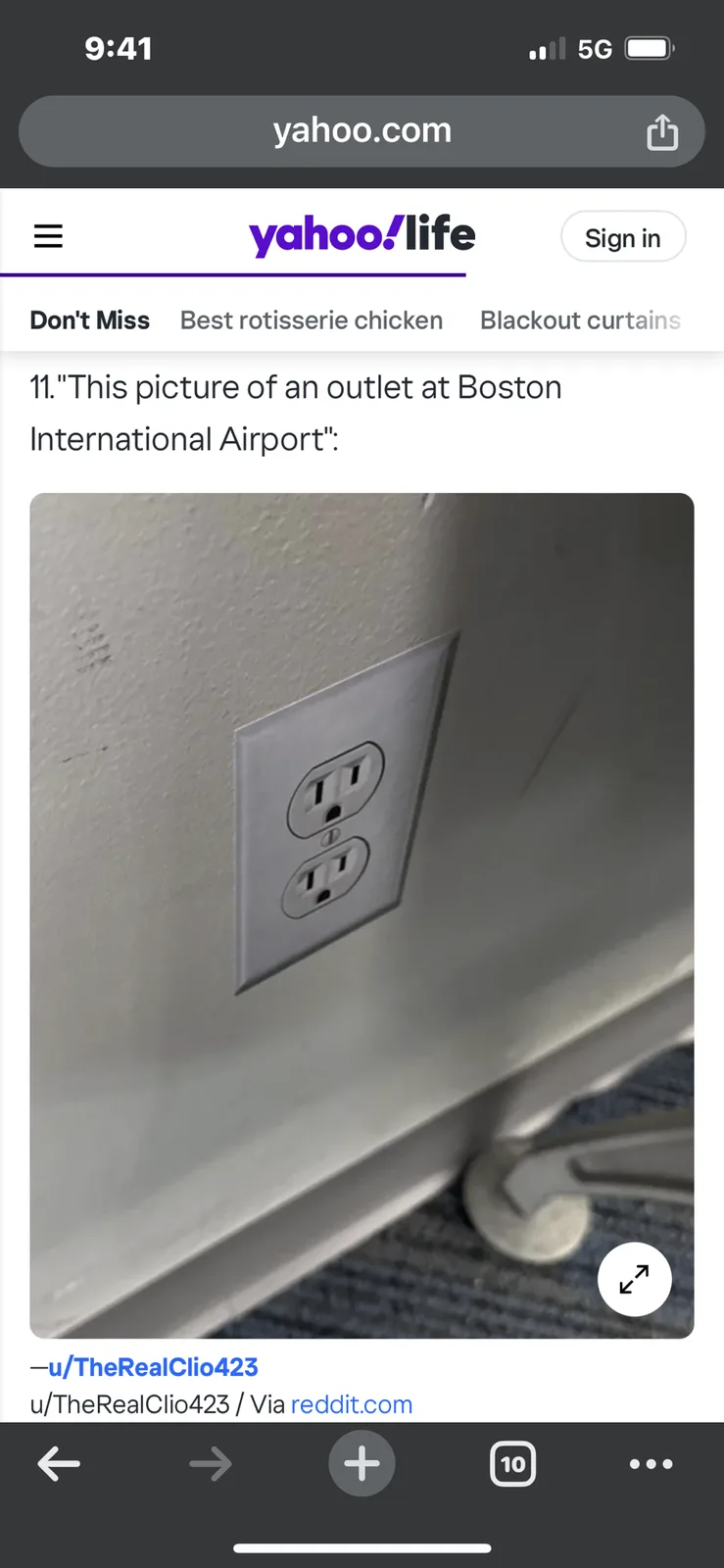 A screenshot of a Yahoo Life article showing a close-up photo of a standard US electrical outlet mounted on a wall, with the…