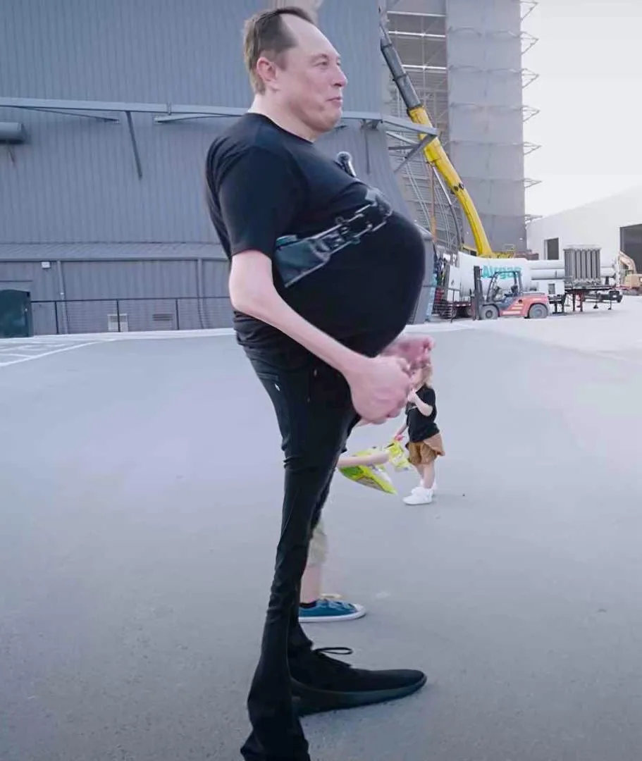 A man, identified as Elon Musk, is shown standing outdoors in front of industrial buildings with a digitally altered…