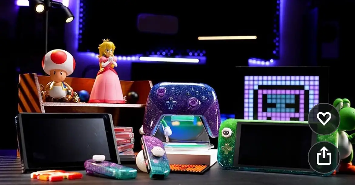 A staged photo of Nintendo Switch consoles and accessories, including a glittery purple controller, a green Switch Lite, and…