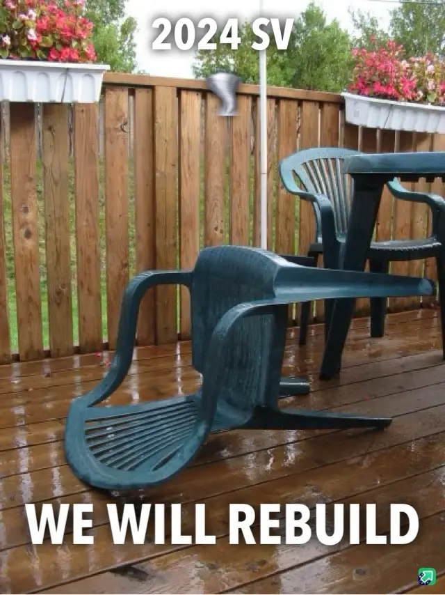 A broken green plastic patio chair lies on its side on a wet wooden deck, with another chair and table behind it. The text…