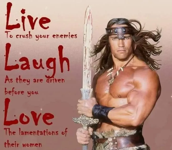 A muscular man with long hair and a headband, holding a sword, is shown against a plain background. Overlaid text in red…