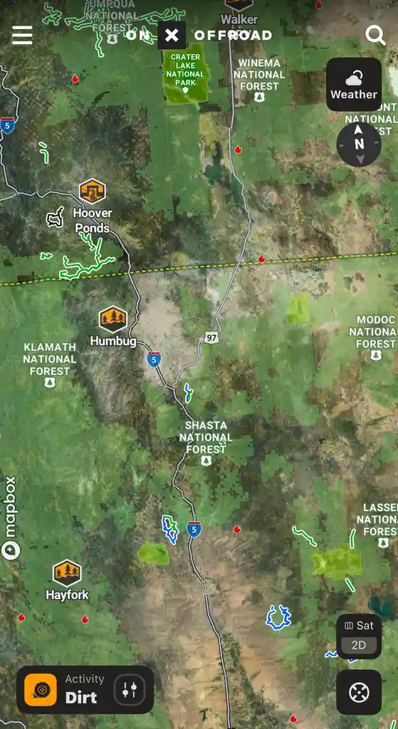 A screenshot of an off-road navigation app displaying a map of northern California with national forests, highways, and…