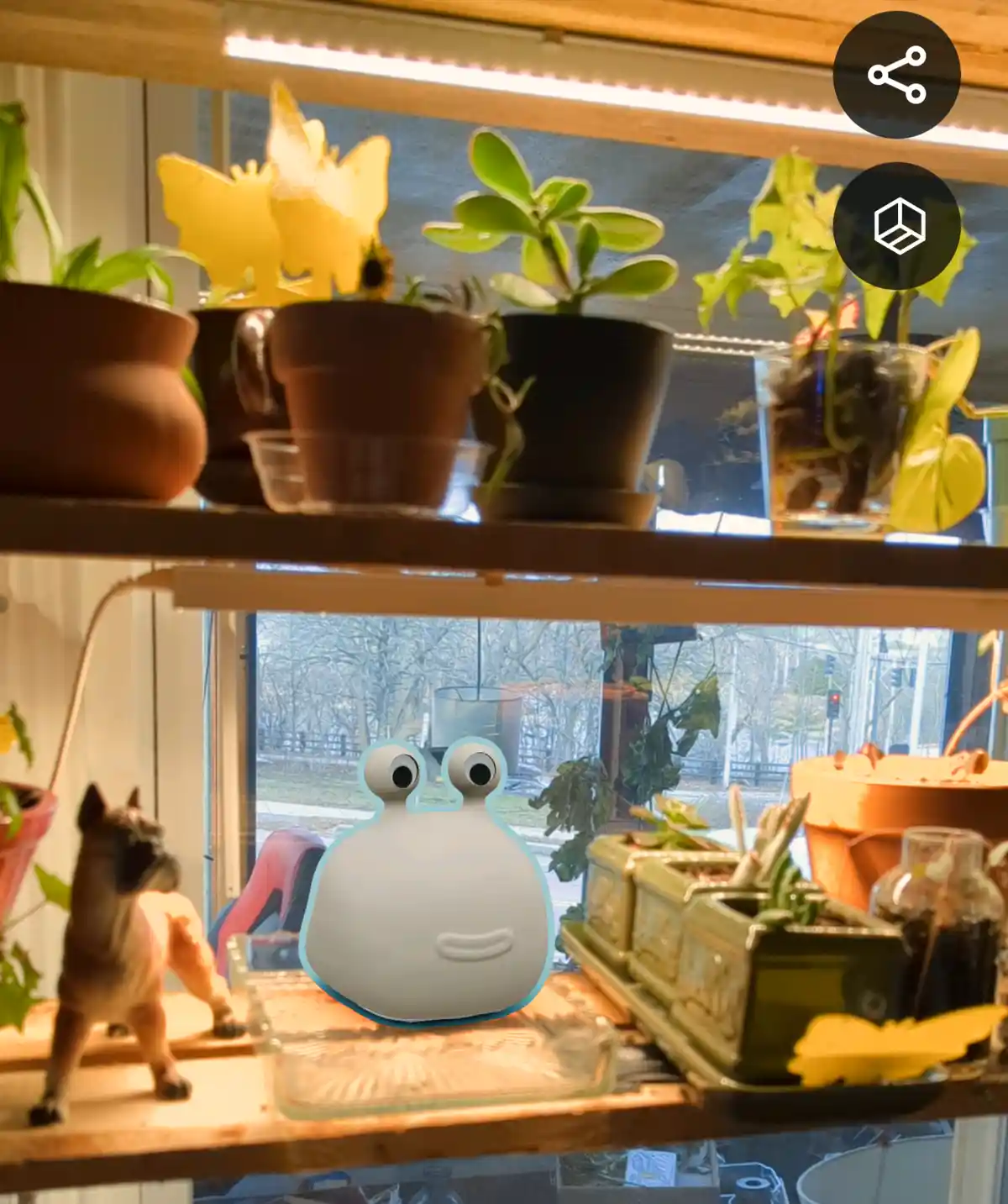 A photo of a wooden shelf with various potted plants and a small dog figurine, overlaid with a cartoon snail emoji. The…