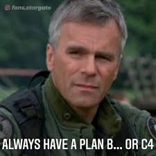 A close-up image of actor Richard Dean Anderson as the character Jack O'Neill from Stargate, wearing a green military…