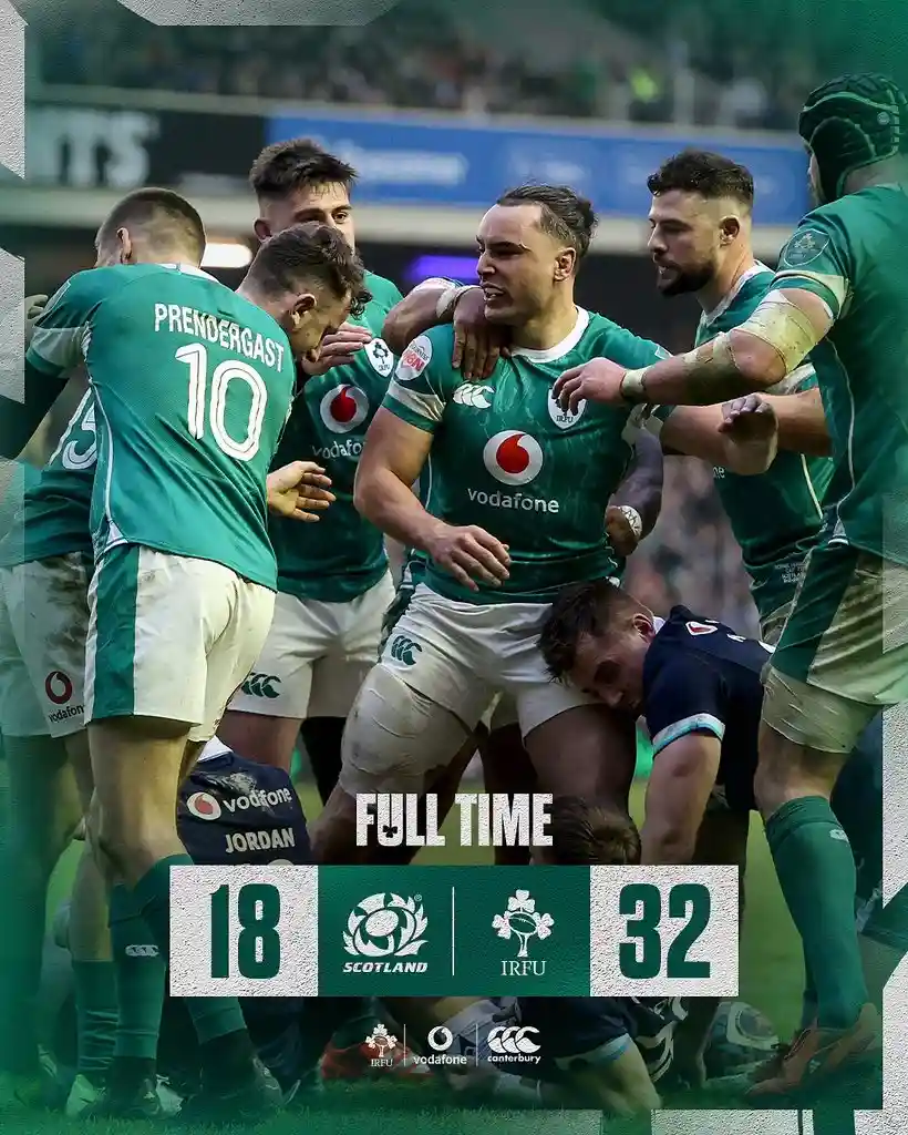 A group of Irish rugby players in green jerseys celebrate after a match, with one player prominently in the center. Overlaid…