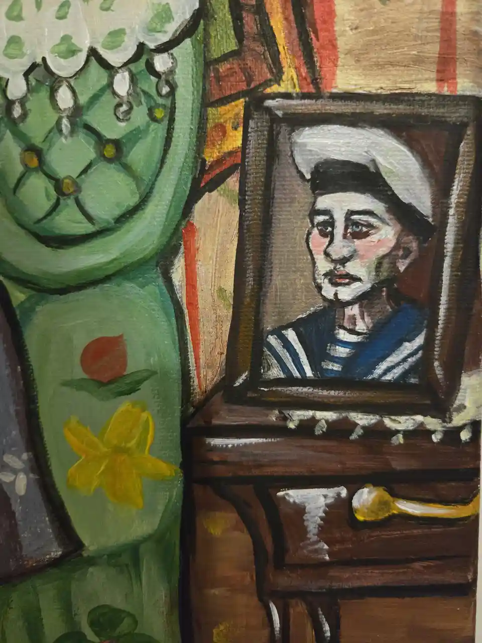 A painting depicts a framed portrait of a sailor with a somber expression, placed on a wooden table beside a green…