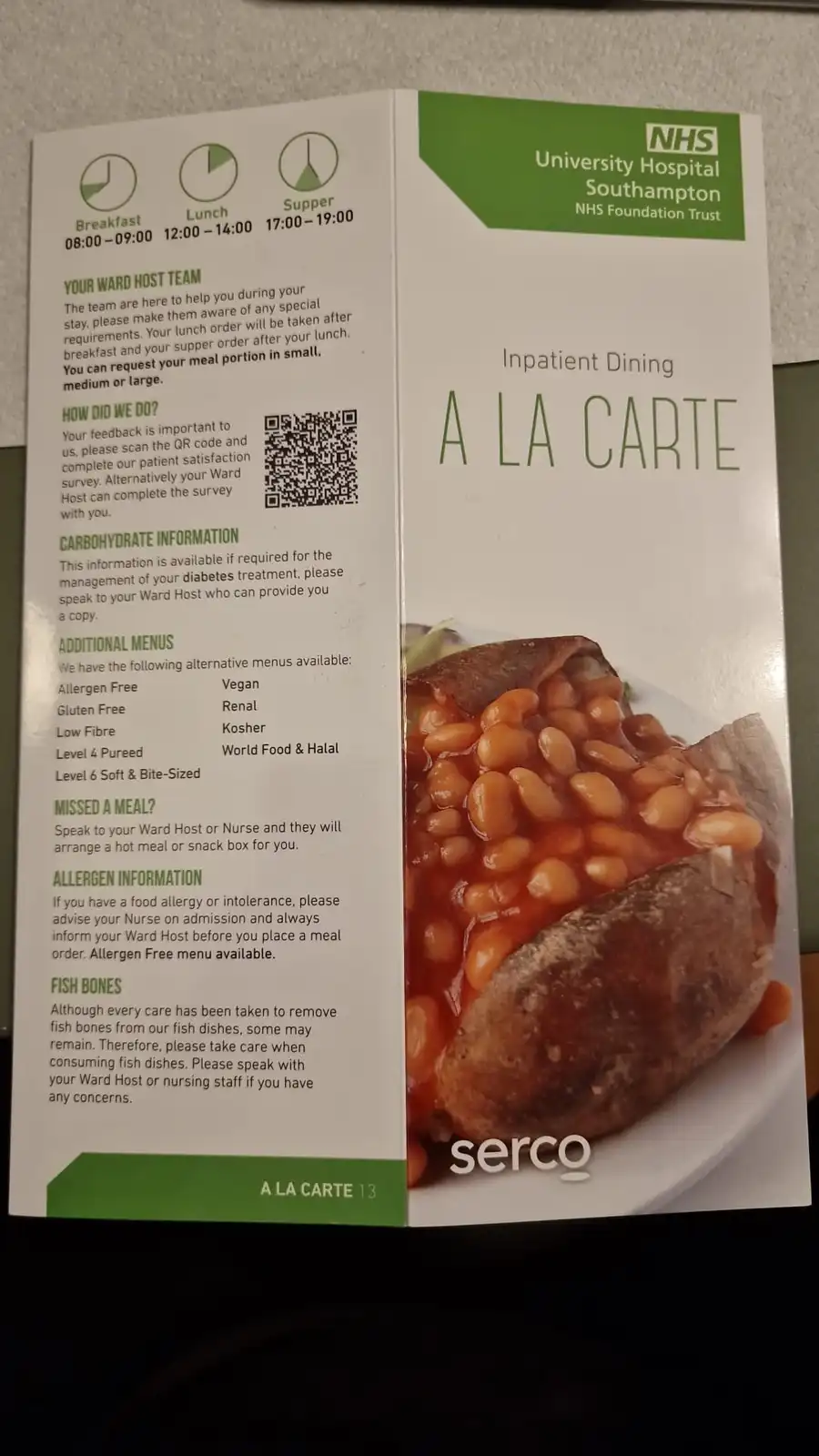 A hospital meal menu from NHS University Hospital Southampton, featuring a photo of baked beans on a potato. The menu…