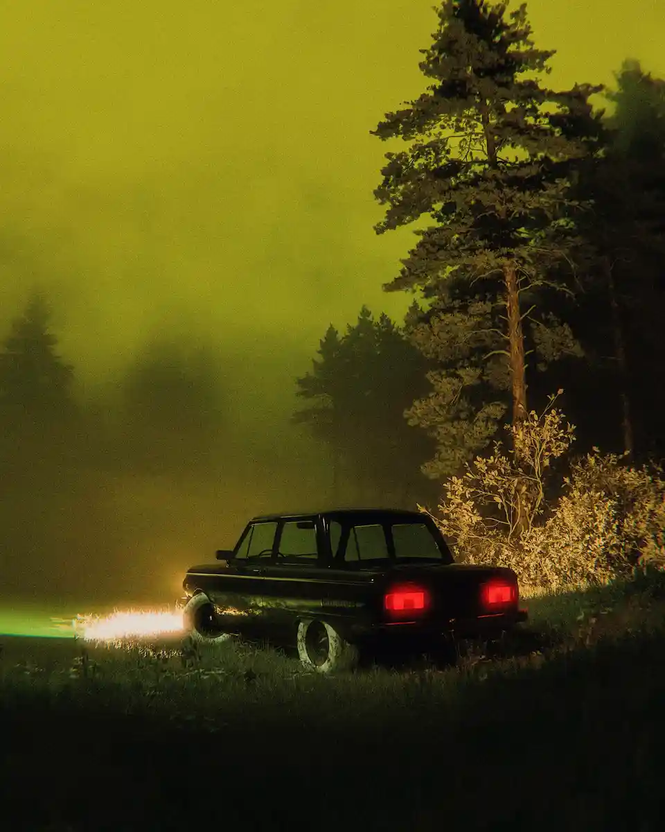A vintage black station wagon is parked in a misty, forested area under a hazy yellow-green sky. Its rear red taillights are…