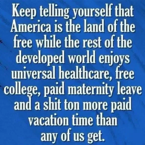 A solid blue background with white text that reads: 'Keep telling yourself that America is the land of the free while the…