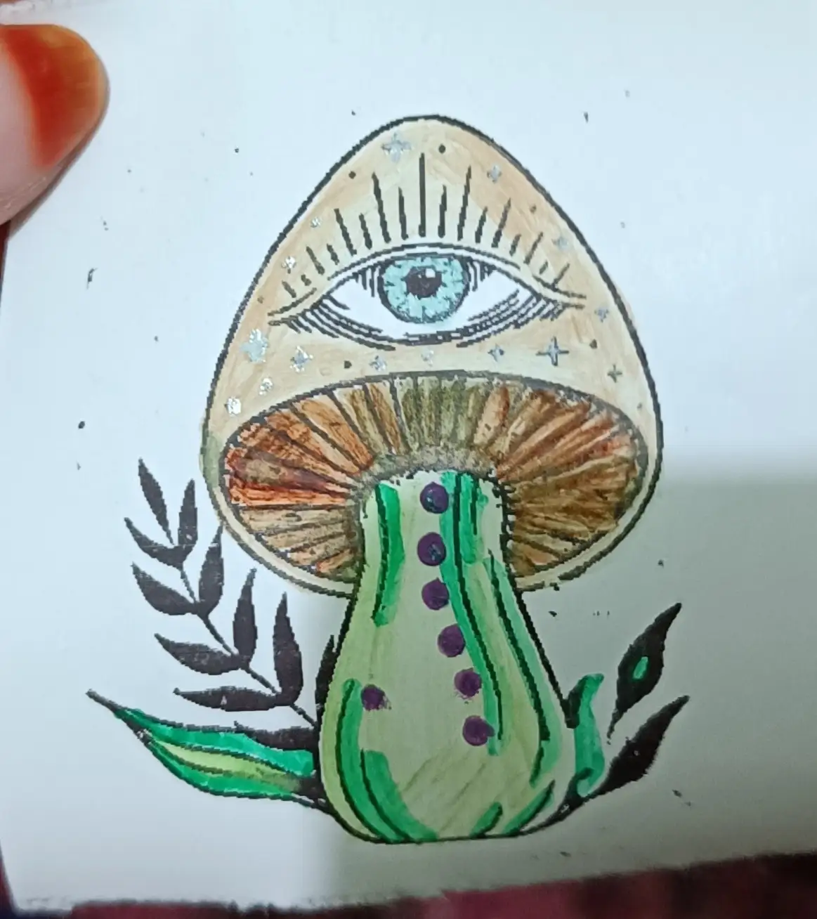 A hand-drawn illustration of a mushroom with a large, detailed blue eye on its cap, surrounded by stars and radiating lines…