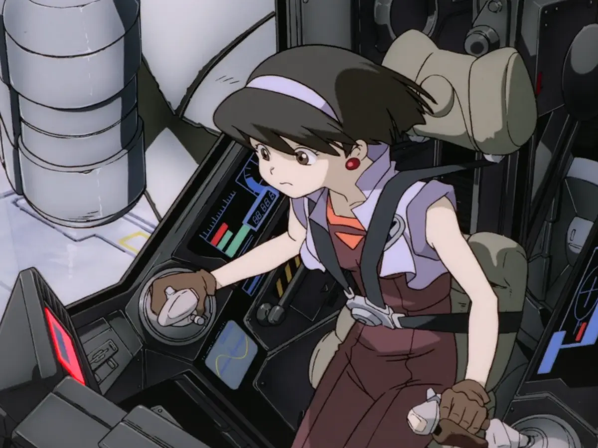an anime girl with brown hair and a white headband sits in a cockpit, gripping control sticks with a worried expression. She…