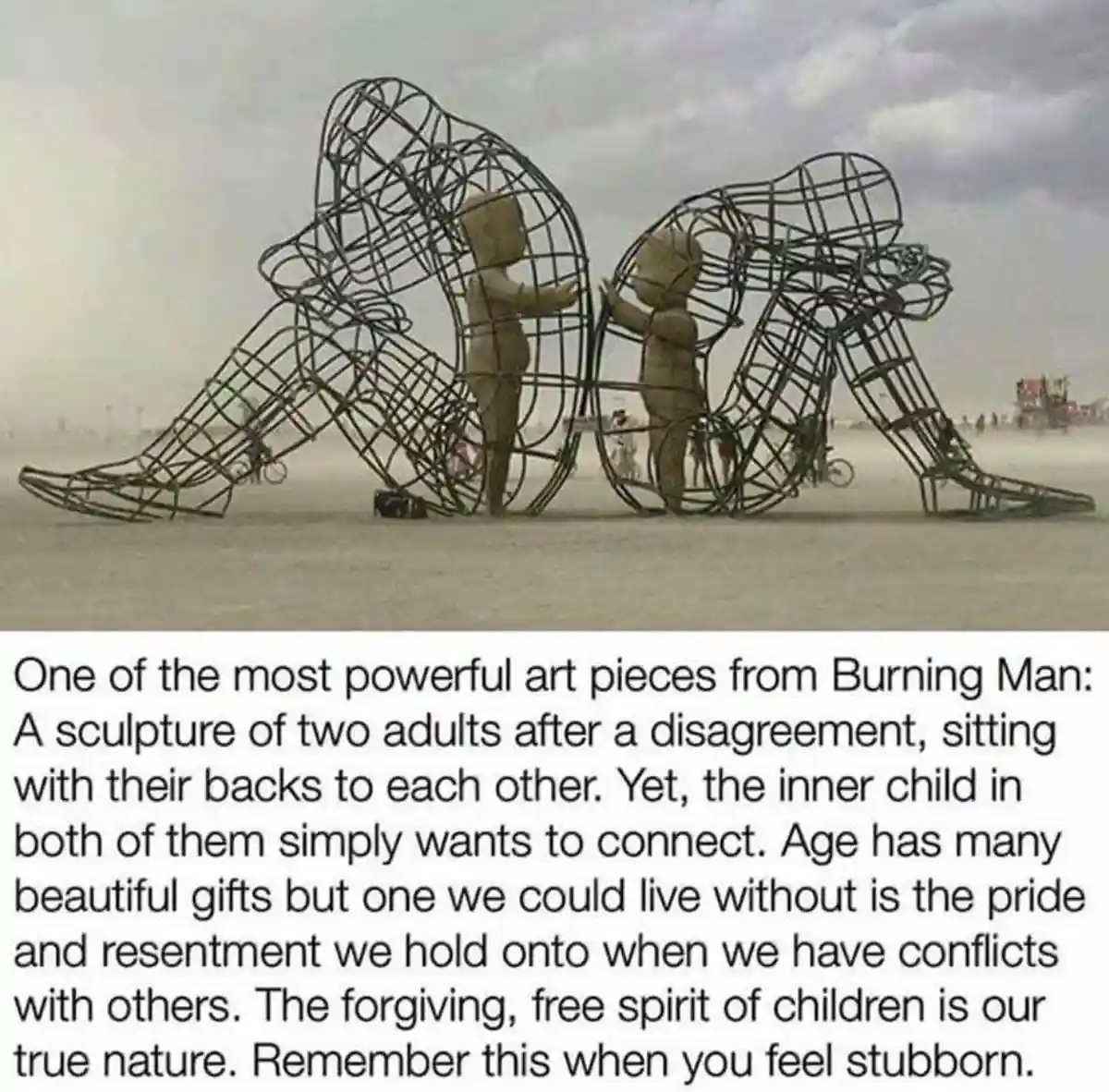 A large metal sculpture at Burning Man depicts two adults sitting with their backs turned to each other, but their inner…