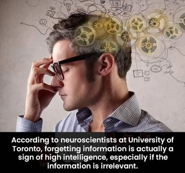 A man in glasses and a checkered shirt holds his head in apparent frustration or deep thought, with golden gears and doodles…