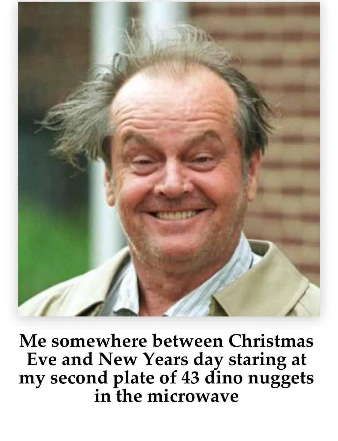 A close-up photo of actor Jack Nicholson with messy hair, a wide grin, and crinkled eyes, wearing a beige jacket over a…
