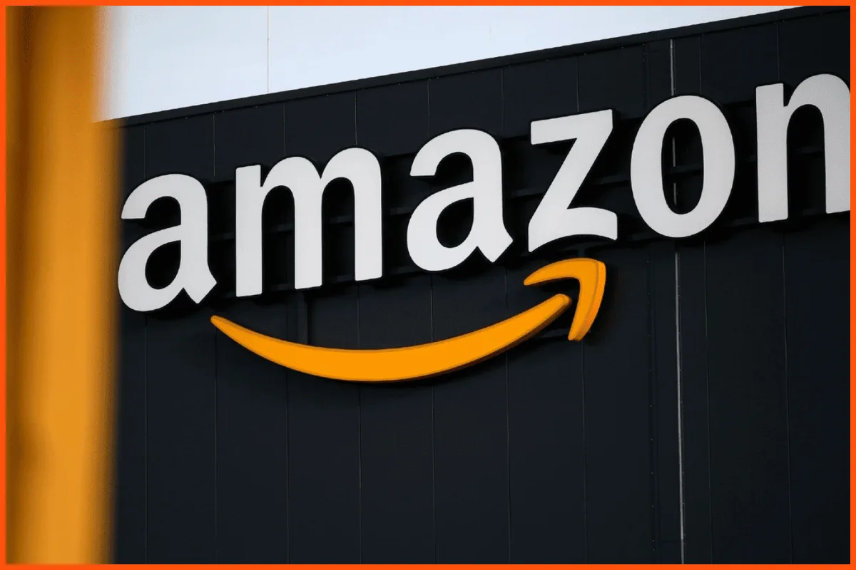 A close-up photograph of the Amazon corporate logo, featuring the word 'amazon' in white lowercase letters with the iconic…
