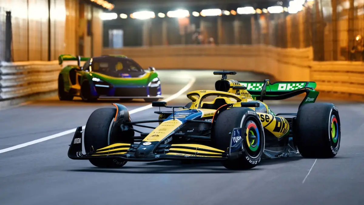 A yellow and blue Formula 1 race car with 'RICHARD MILLE' and 'DP WORLD' branding is in the foreground on a racetrack, with…