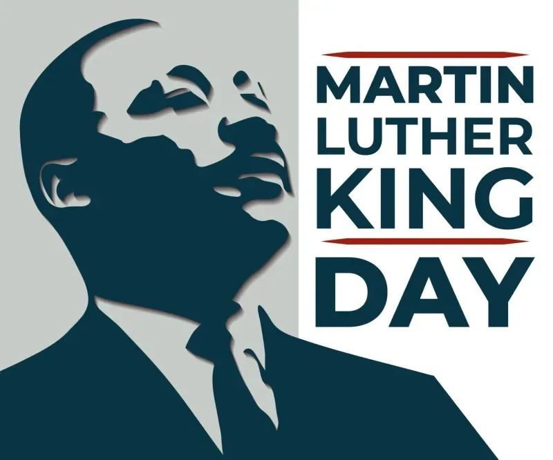 A stylized graphic shows a dark blue silhouette of Martin Luther King Jr. in profile, looking upward, against a light gray…
