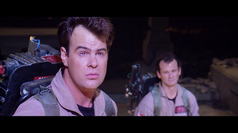 A still from the movie 'Ghostbusters' shows actor Bill Murray in the foreground with a worried, apprehensive expression…