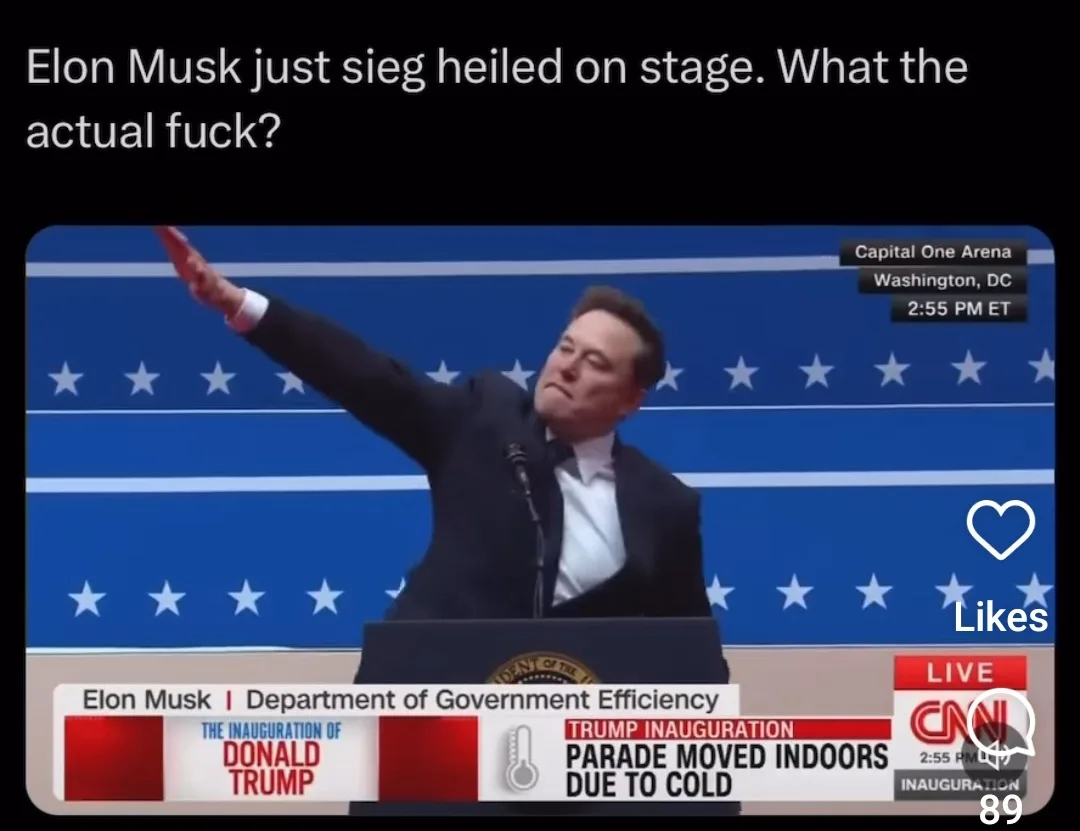 A screenshot of a CNN broadcast shows Elon Musk at a podium with a blue starry backdrop, raising his right arm in a…
